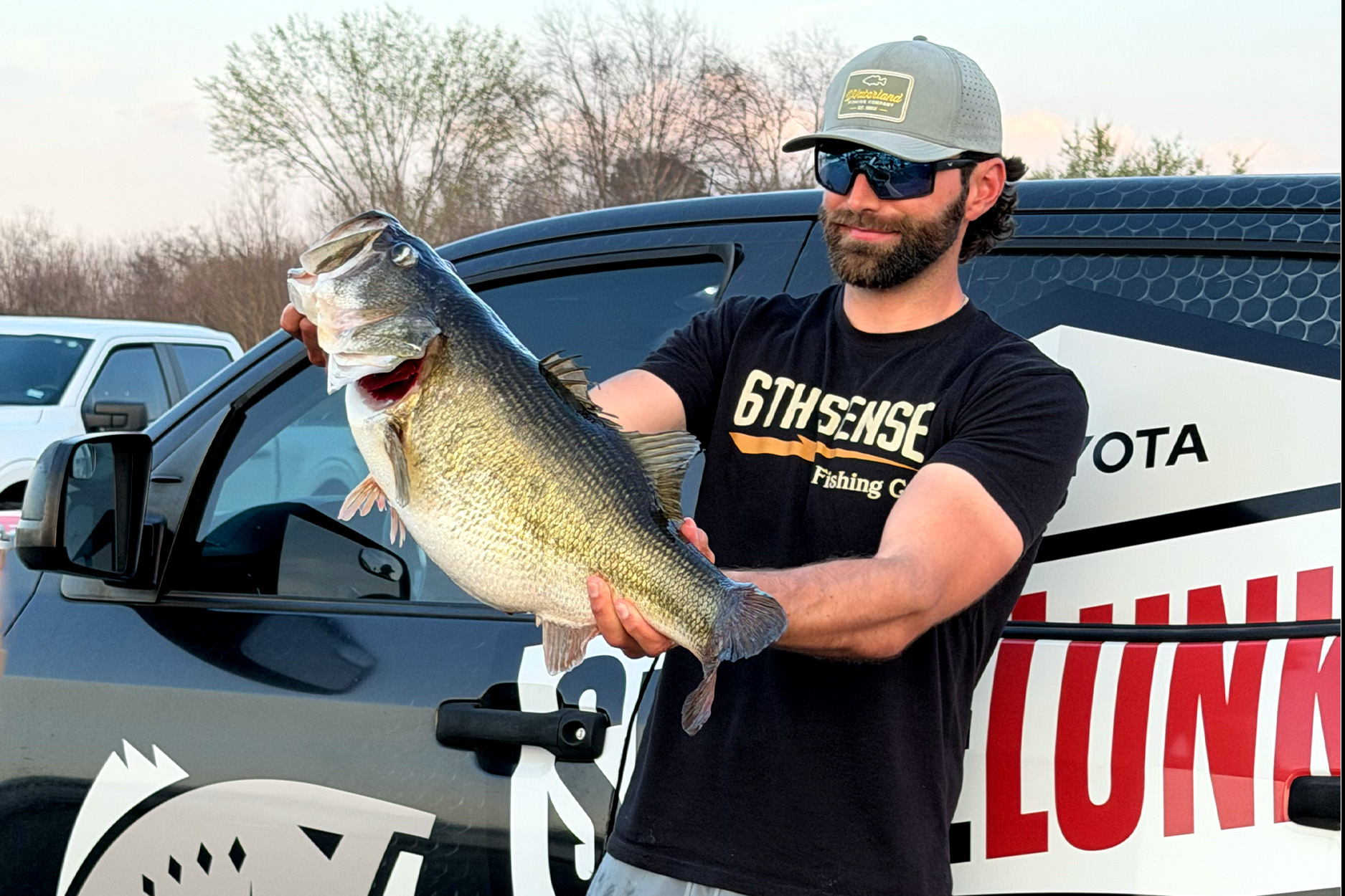 An angler holds up a ShareLunker Bass in Texas.