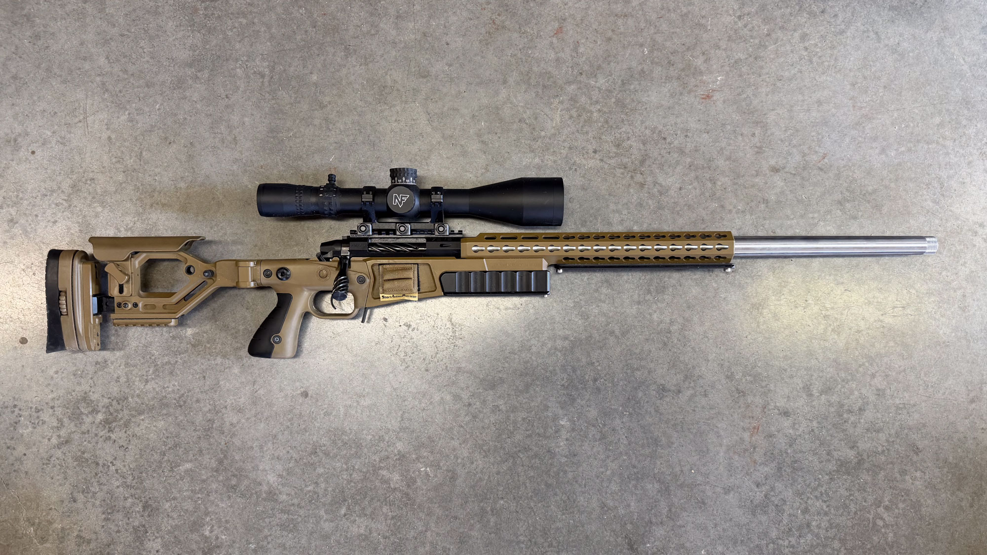The Falkor 7Even rifle chambered in 25 Creed photographed on concrete