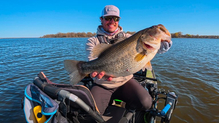 Bailey Eigbrett with a big bass caught from a kayak