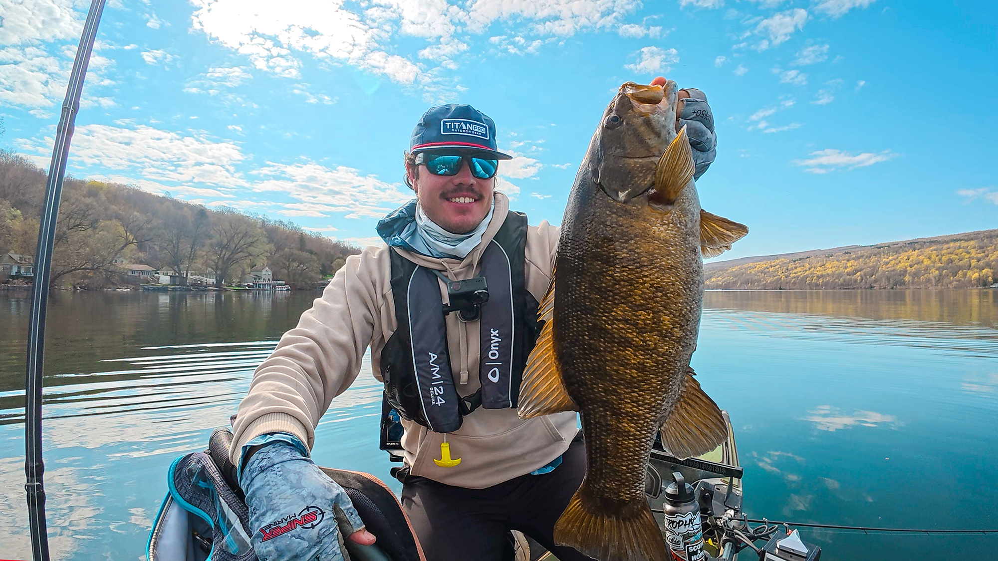 Bailey Eigbrett with a big smallmouth caught from a kayak