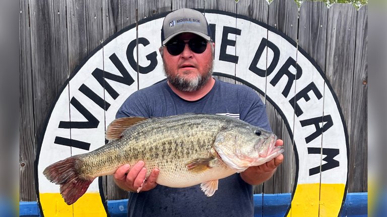 A bass angler with a big Toledo Bend largemouth.