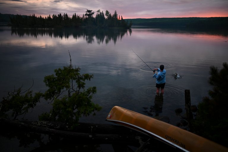 a kid fishing in the bwca.