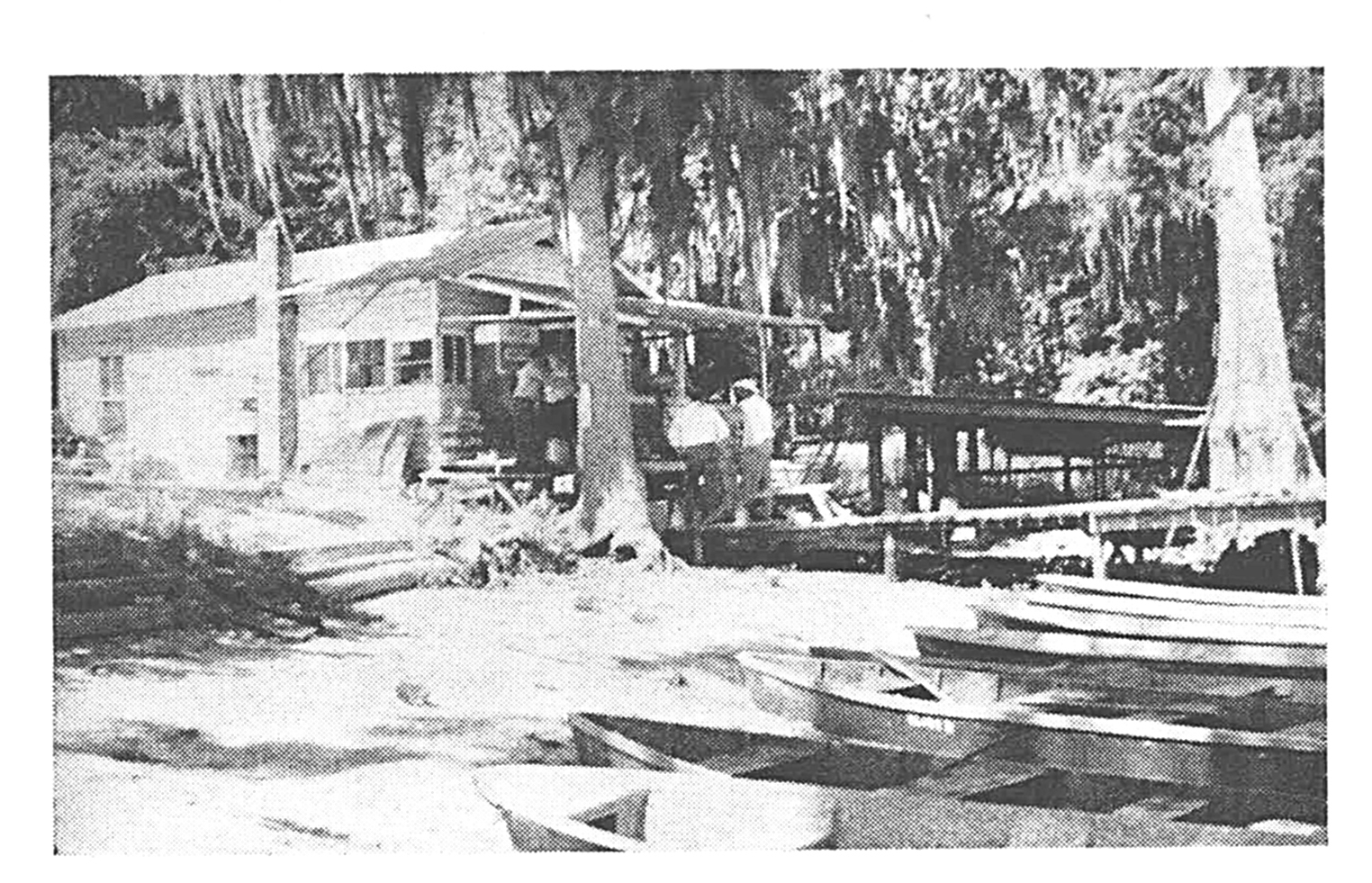 An old black and white photo of fishing camp.