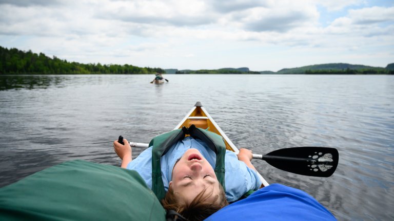 BWCA, MN - JUNE 14: Aidan Jones was exhausted as he paddled North Fowl Lake into South Fowl Lake Friday. Tony Jones, his 14-year old son Aidan, their friend Brad Shannon and Outdoors editor Bob Timmons embarked onto the Voyageurs Highway on Tuesday, June 11, 2019. Their path Tuesday took them from Gunflint Lake, to North Lake, through the Height of Land Portage eventually ending at a camp site on South Lake in the BWCA (Boundary Waters Canoe Area). (Photo by Aaron Lavinsky/Star Tribune via Getty Images)
