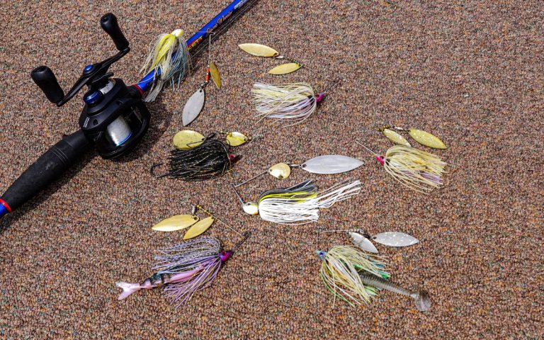 A plethora of spinnerbaits and a rod and reel for fishing them.