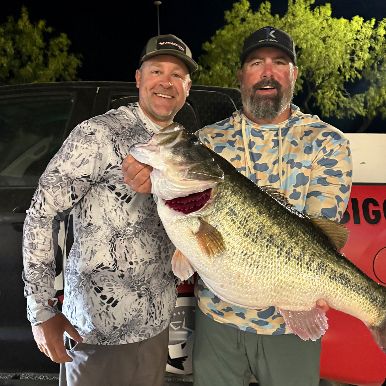 Two anglers with a big Texas bass.