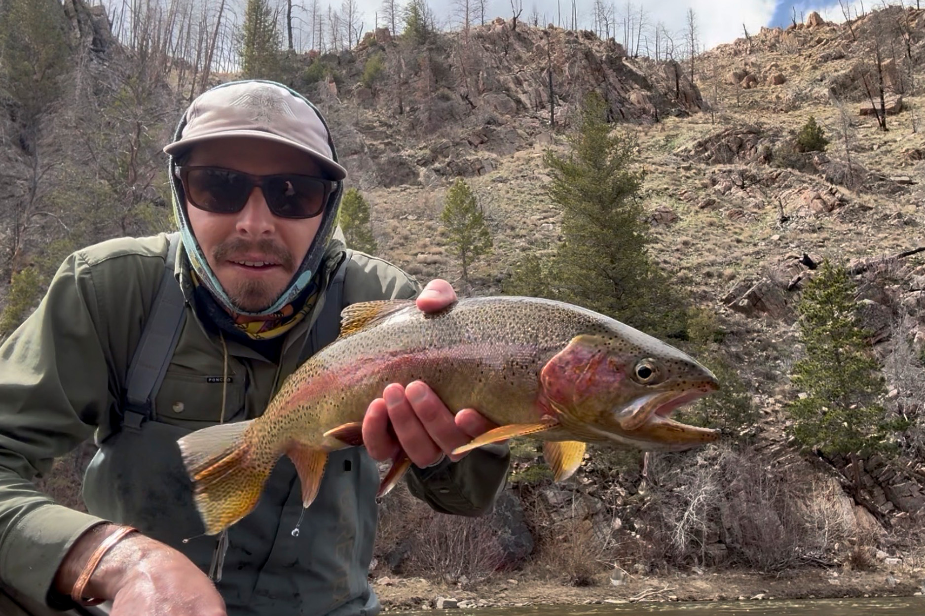 Author with a rainbow trout caught in Colorado.