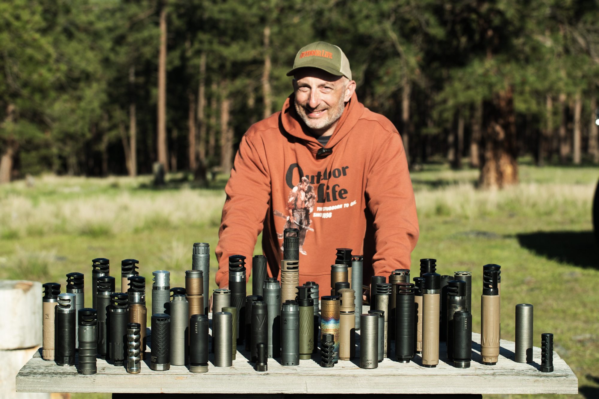 John B. Snow with a table of tested suppressors