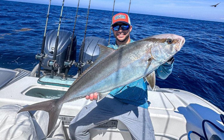 The author holding a greater amberjack