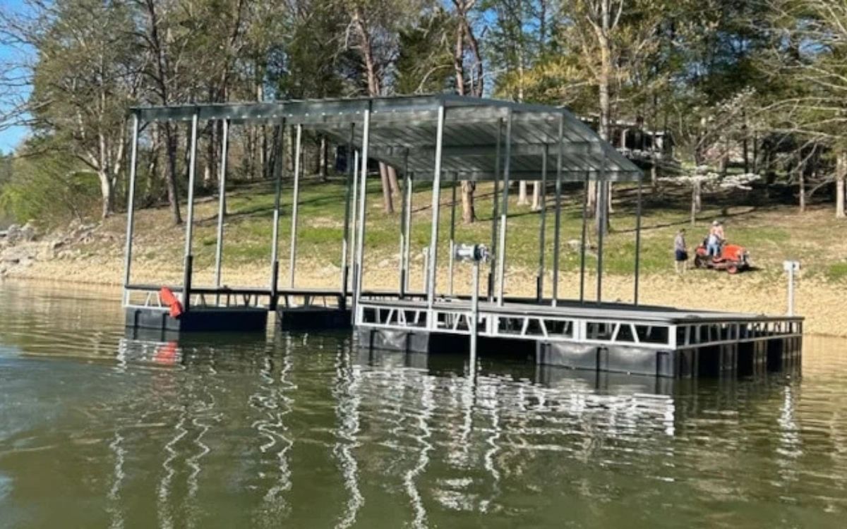 A floating dock sits on a lake.
