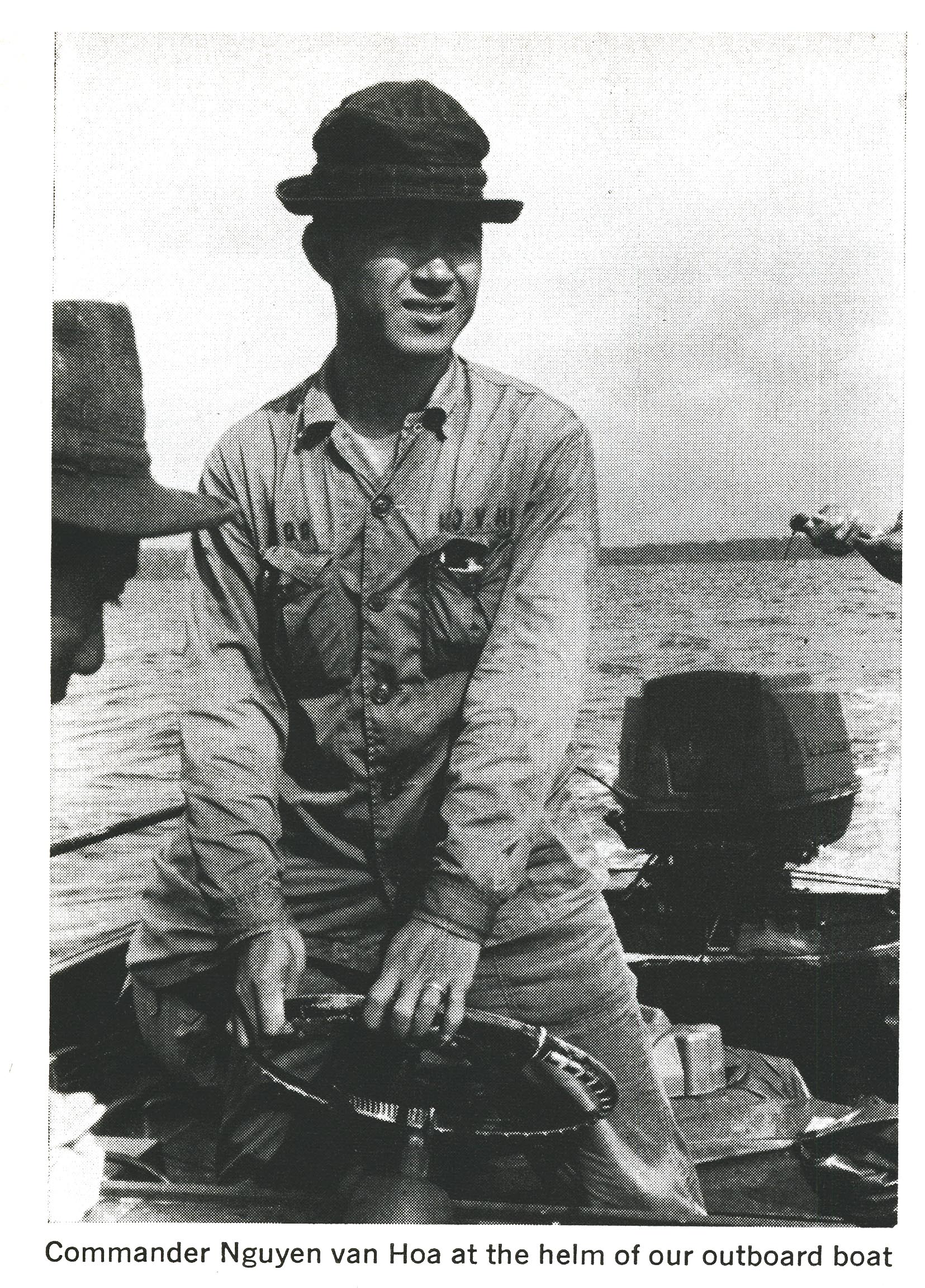 Commander Nguyen van Hoa driving a boat