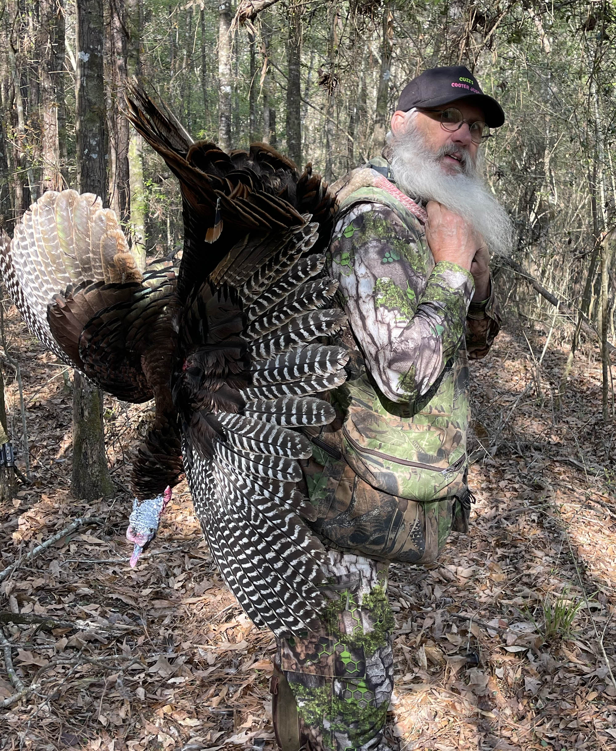DeWitt with a turkey over his back.