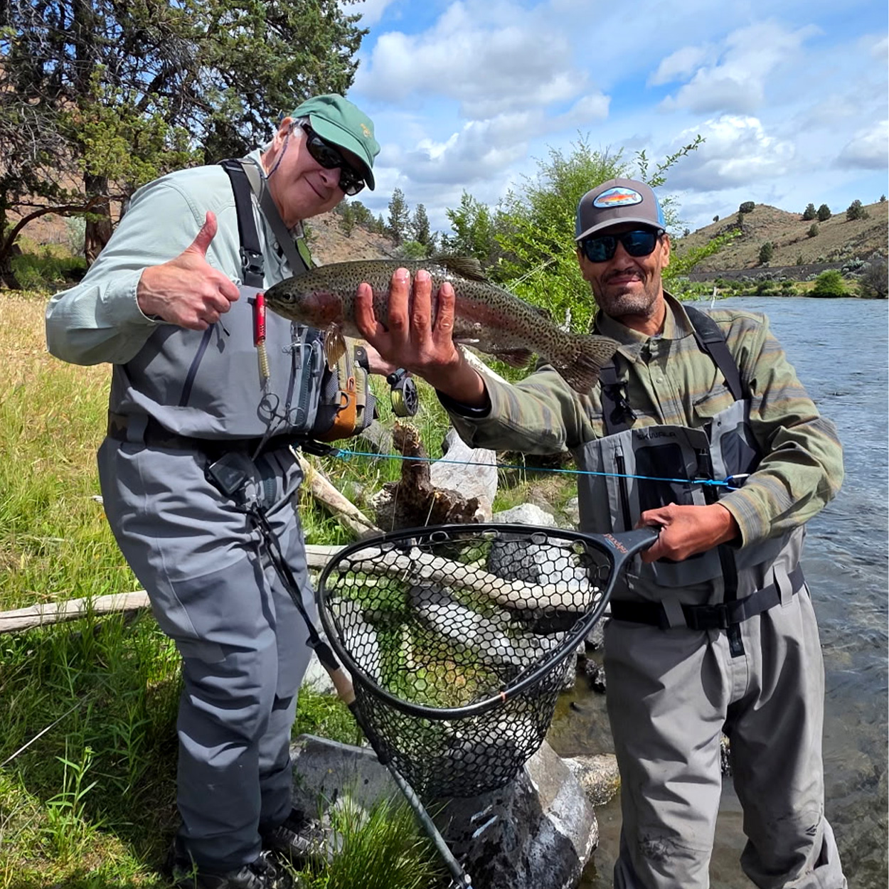 A guide and a fly angler on a river in Oregon.