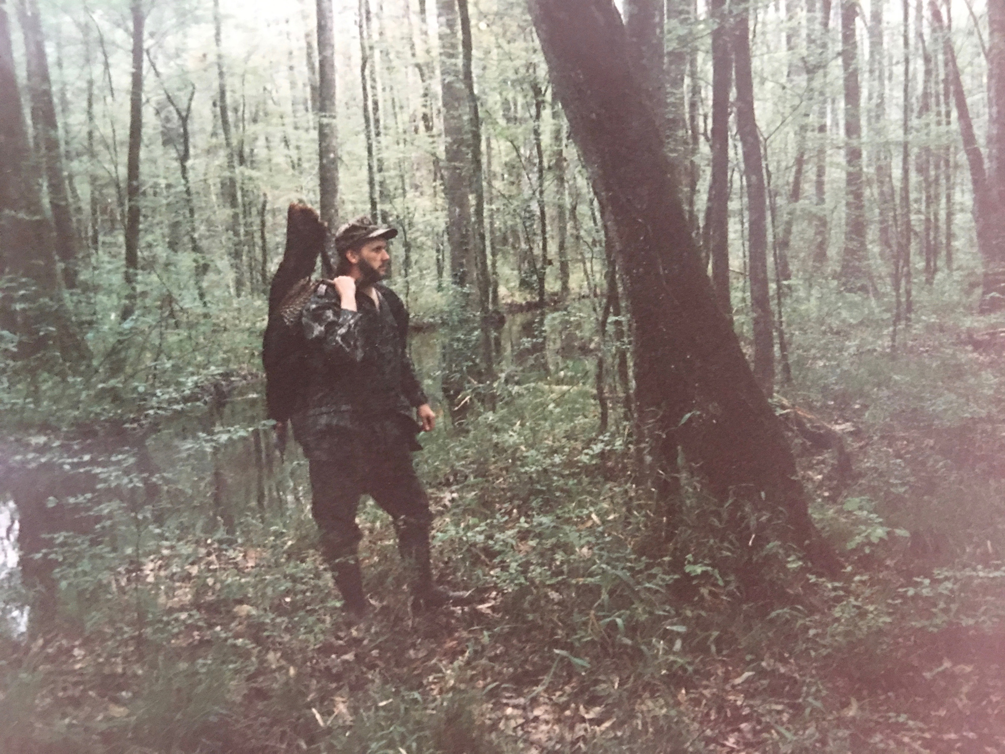 A man with a turkey in the Kisatchie National Forest.