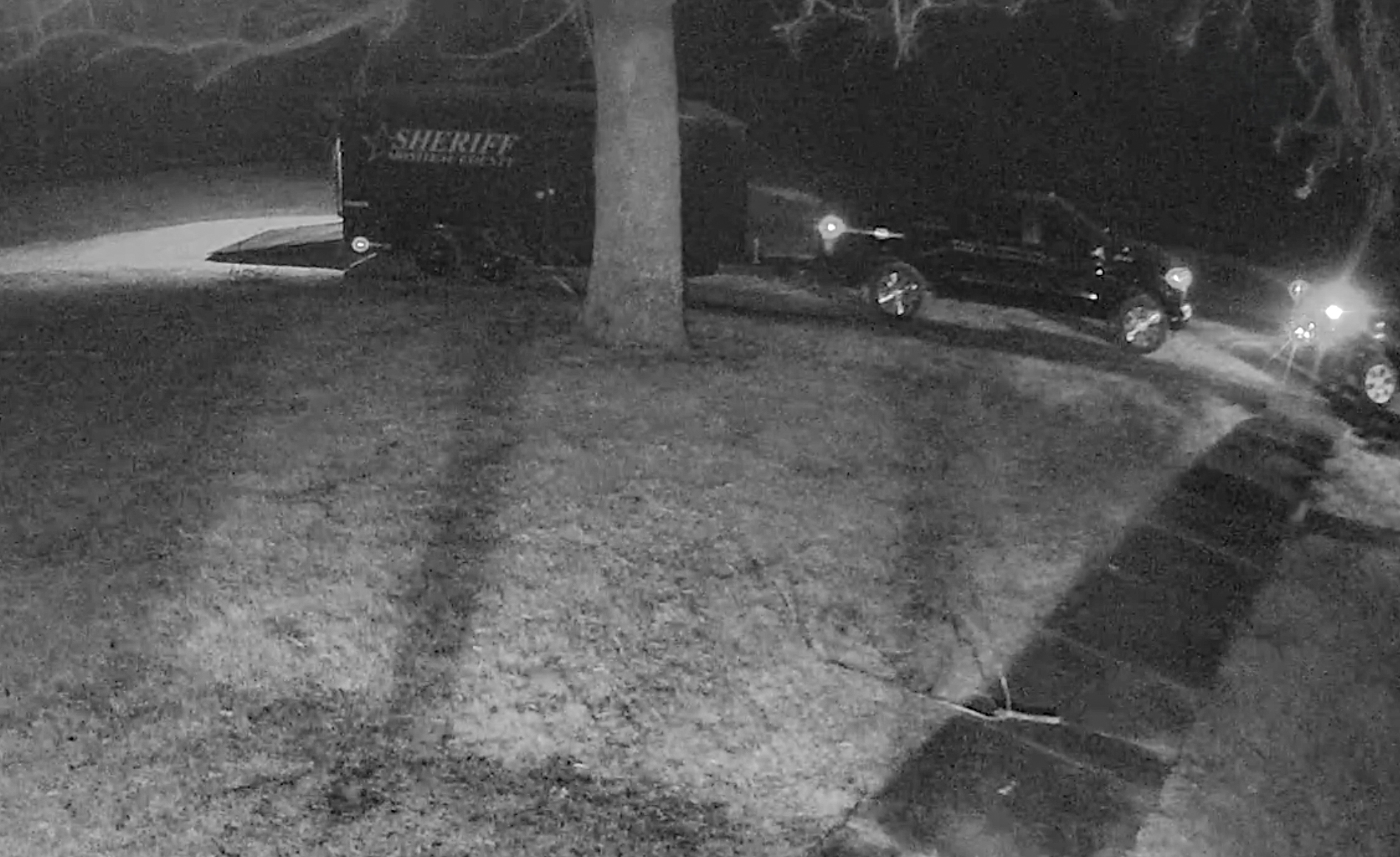 A black and white screenshot from security footage.