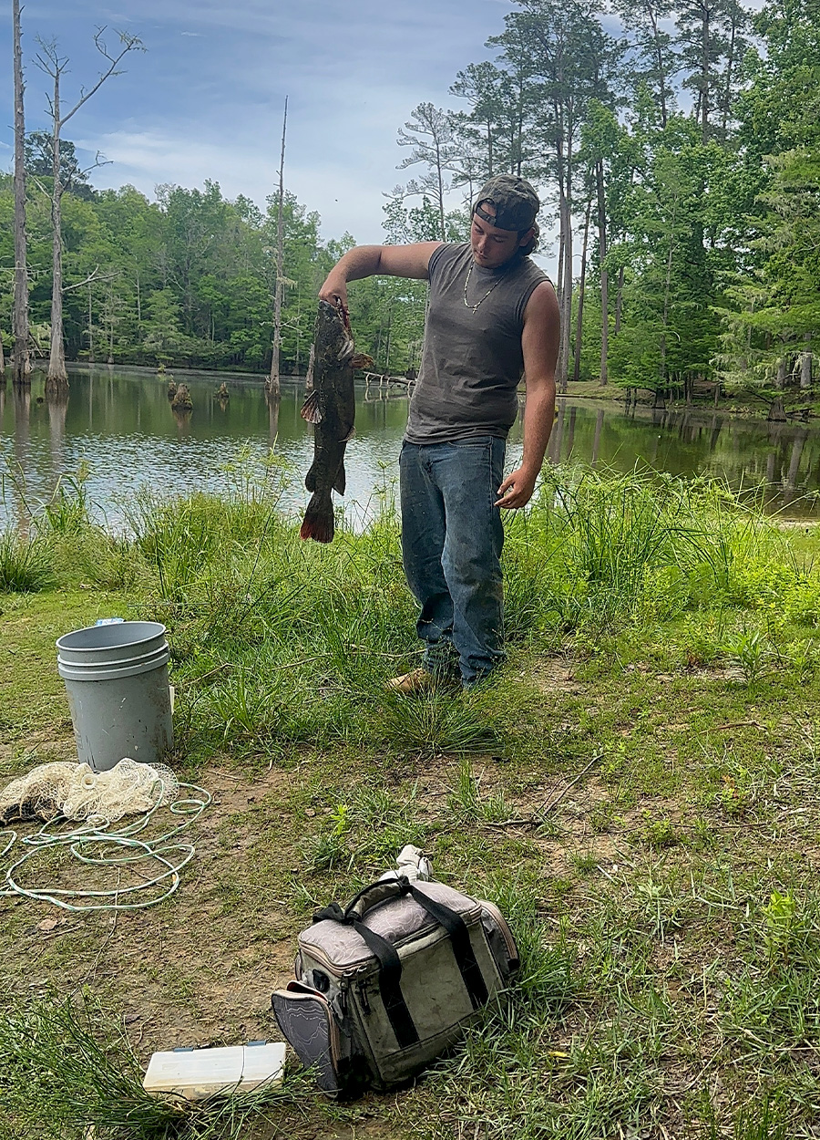 A fisherman with a catfish in East Texas.
