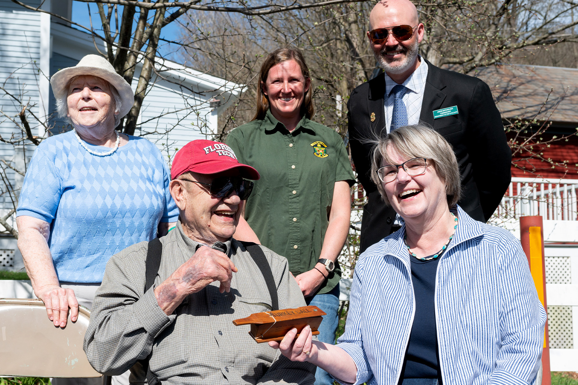 A Vermont turkey hunter hands over an old box call to a local historical society.