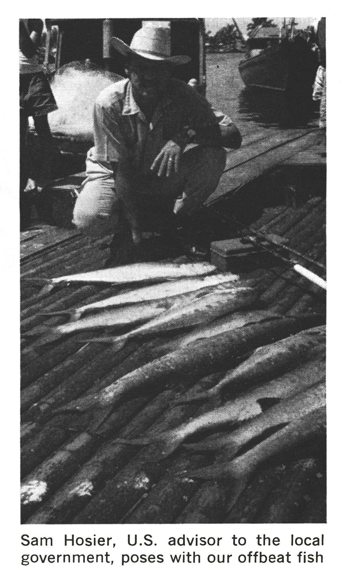An old black and white photo of fish on a dock in Vietnam