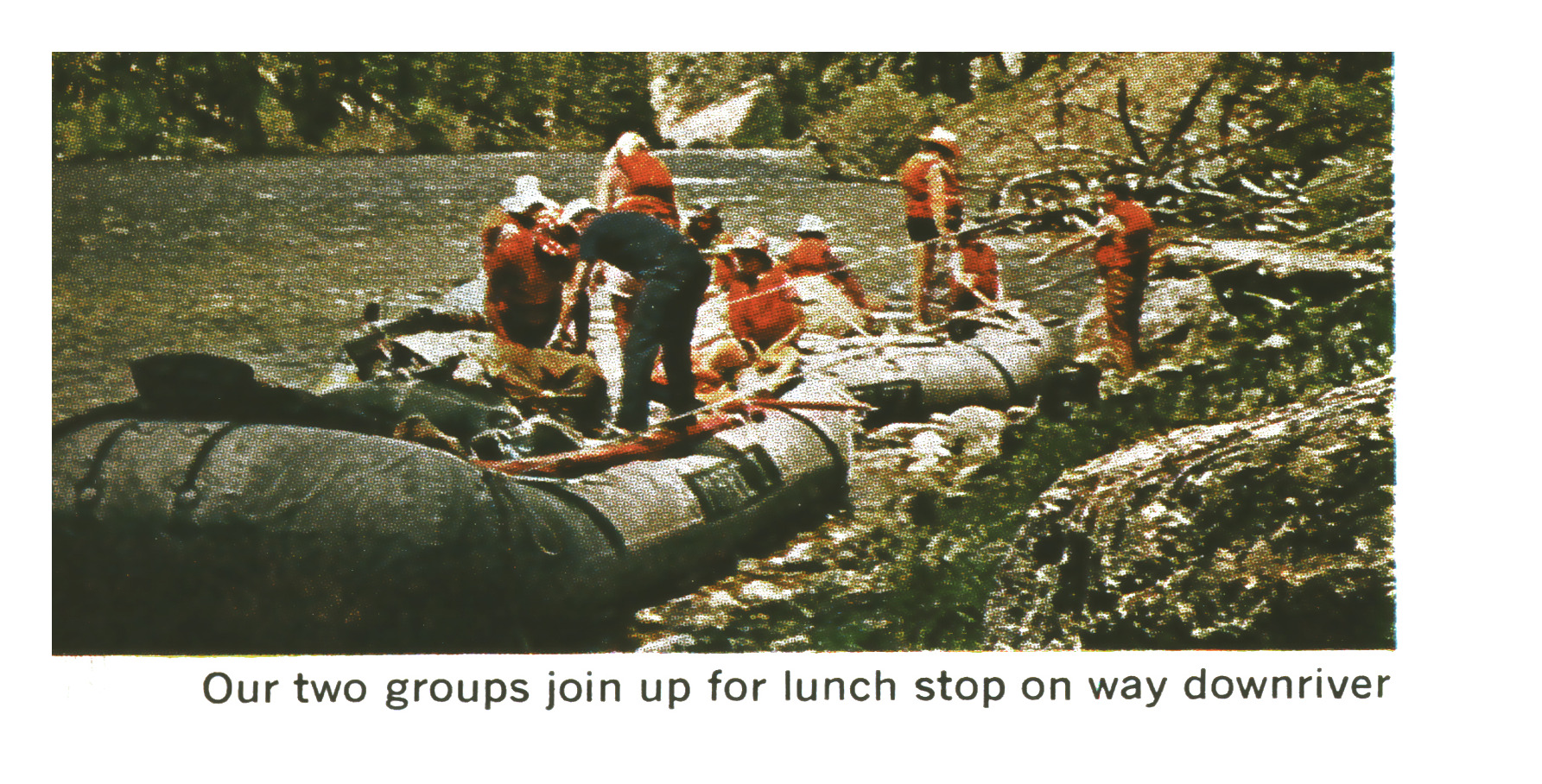 The group's two rafts pulled up to a rocky shore where people in life vests gather for a midday stop along the river.