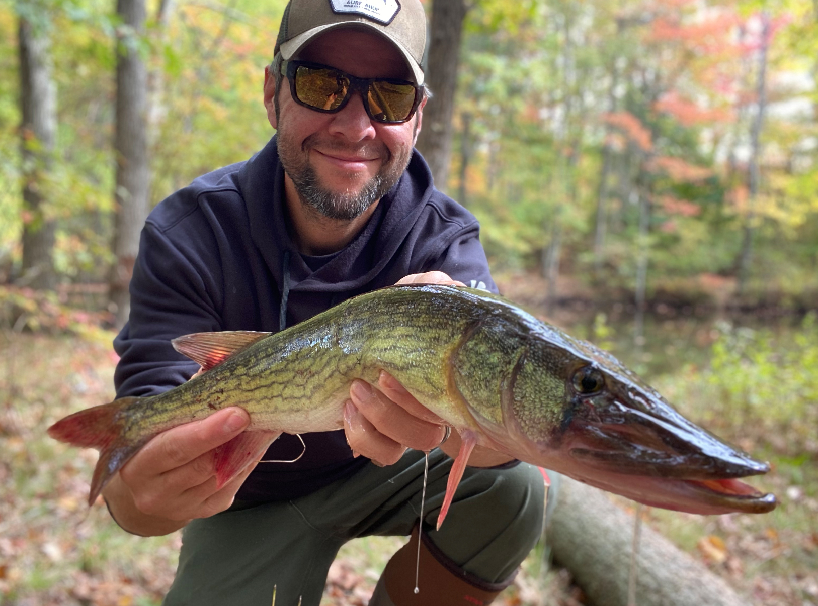 Joe Cermele holding up a chain pickerel.