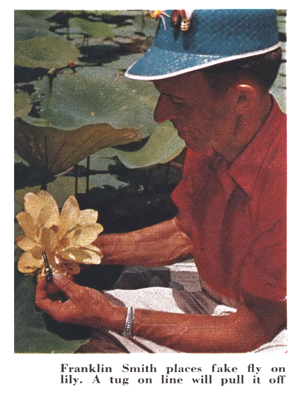 A color photograph of a dragonfly lure on a lily pad