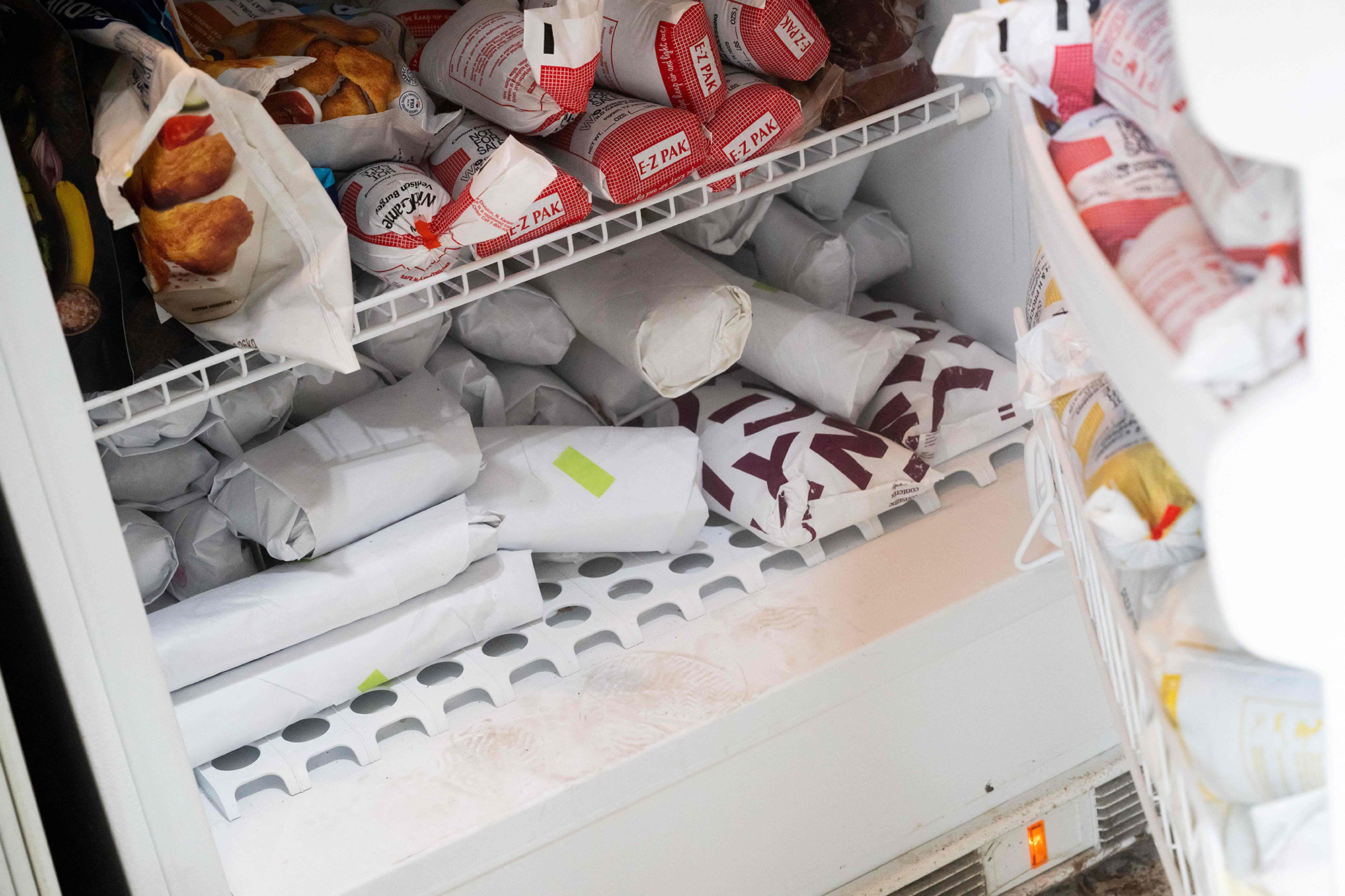 Frozen game meat is seen in the freezer of Taylor Chamberlin, an urban deer hunter with the goal of dealing with overpopulation in urban areas, at his home in Great Falls, Virginia, August 24, 2023. To some, they are a magical sight to behold in the heart of the city -- to others a pest that chomps through their gardens, poses dangers for traffic, and helps spread tick-borne diseases. After being nearly wiped out by rampant deforestation and over-hunting in the 19th century, deer have made a stunning comeback across the United States, thanks to the success of rehabilitation programs. Current estimates place their numbers at greater than 30 million, much of it focused along the East Coast. In Washington, they threaten the future of Rock Creek Park, a "hidden gem" stretching across 1,754 acres that offers residents the opportunity to find refuge from the daily bustle in the federal government's seat of power. (Photo by SAUL LOEB / AFP) (Photo by SAUL LOEB/AFP via Getty Images)