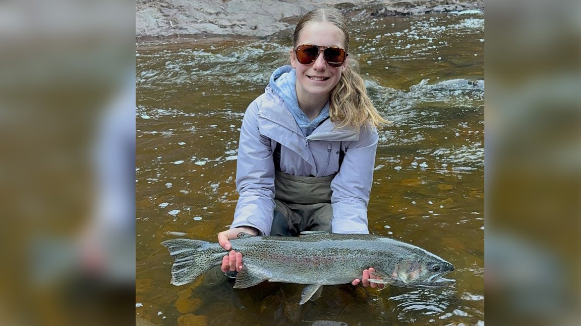 A 12-year-old angler with a state-record rainbow trout.