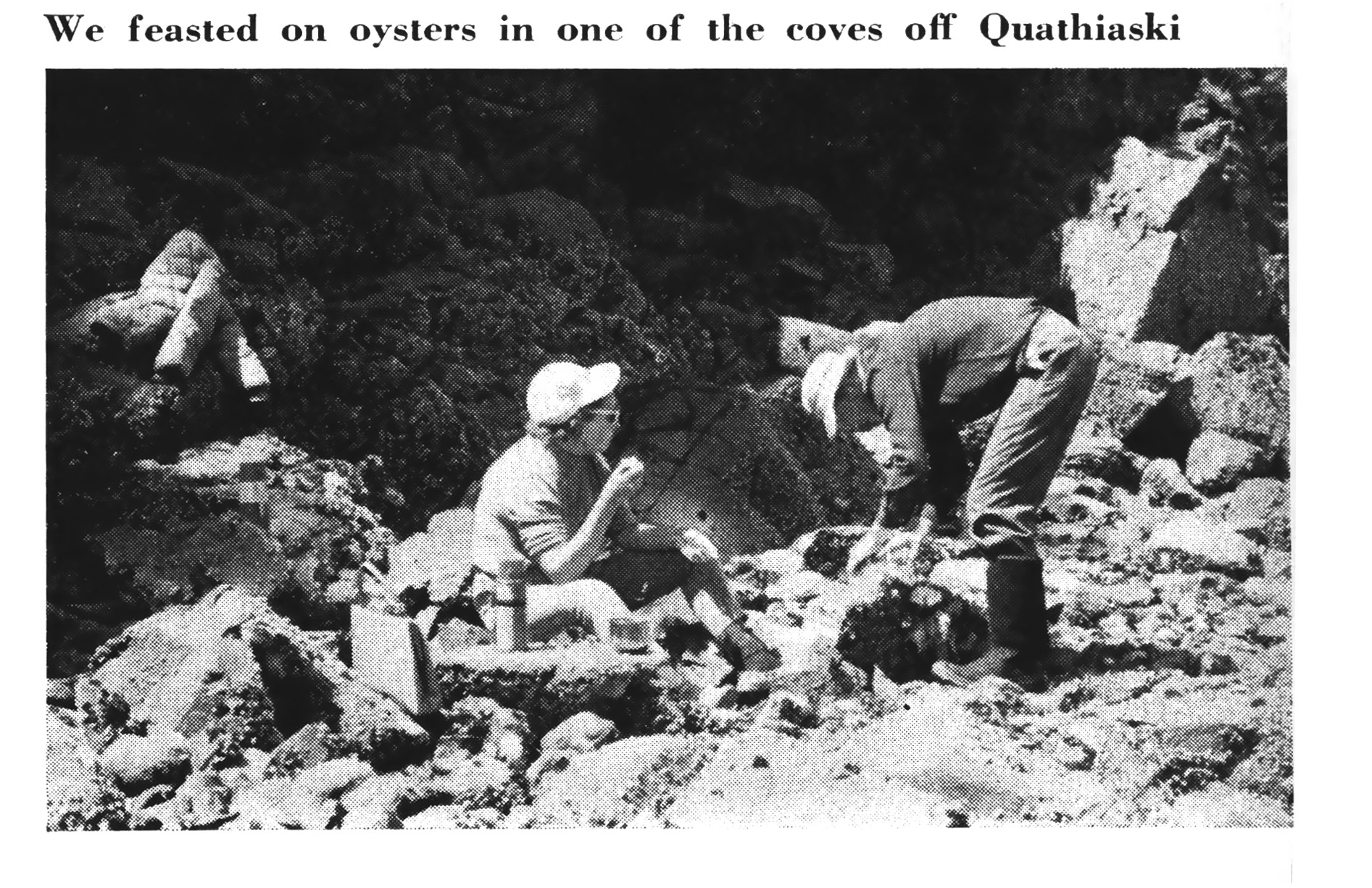 A vintage black and white photo of a couple eating oysters along Quadra Island