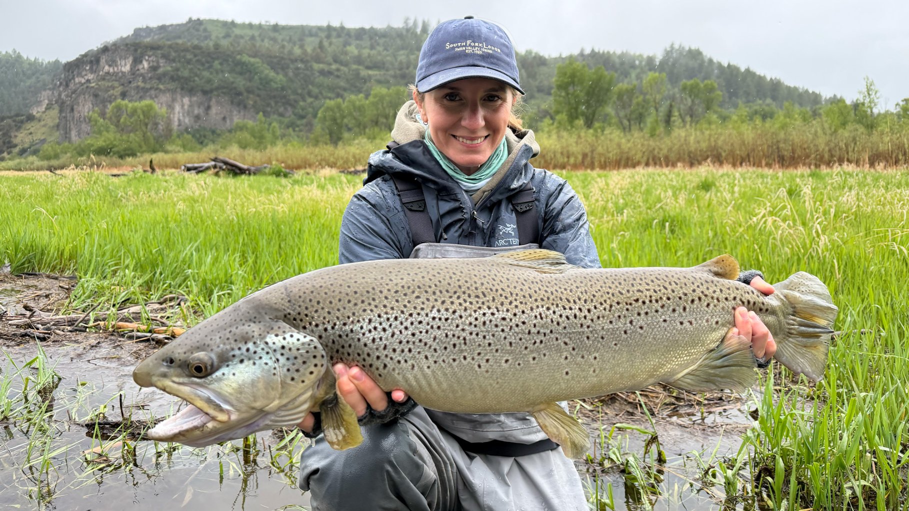 An angler holds up a massive brown trout in Idaho.