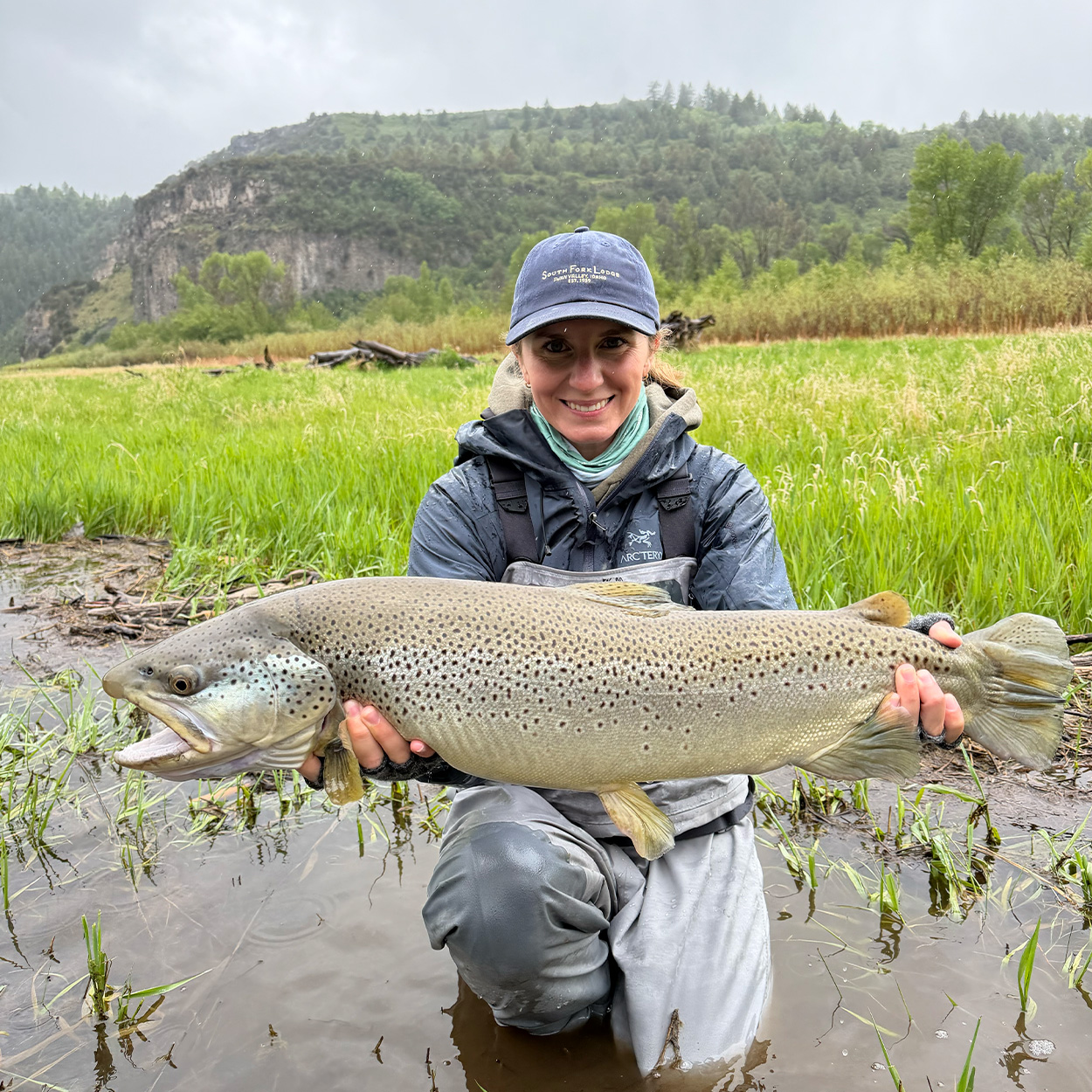 An angler with a huge Idaho brown trout.