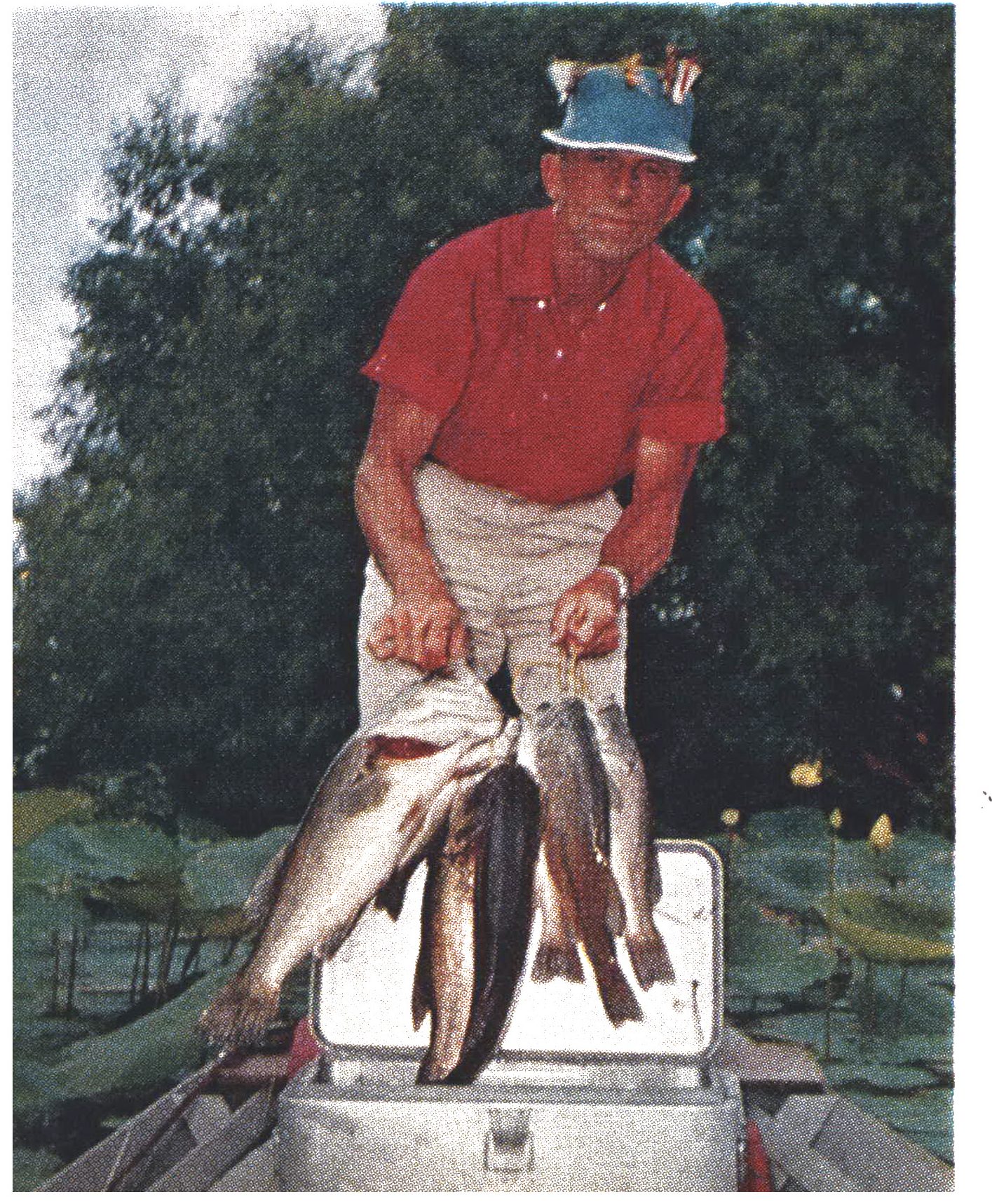 A color photograph of a stringer of bass.
