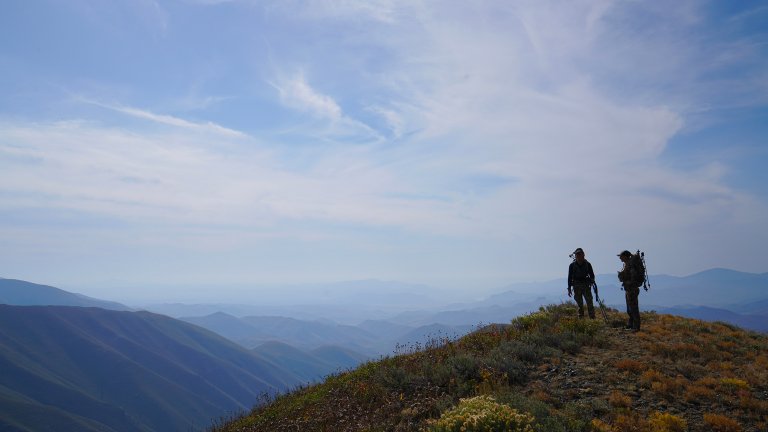 Hunters on a mountain top