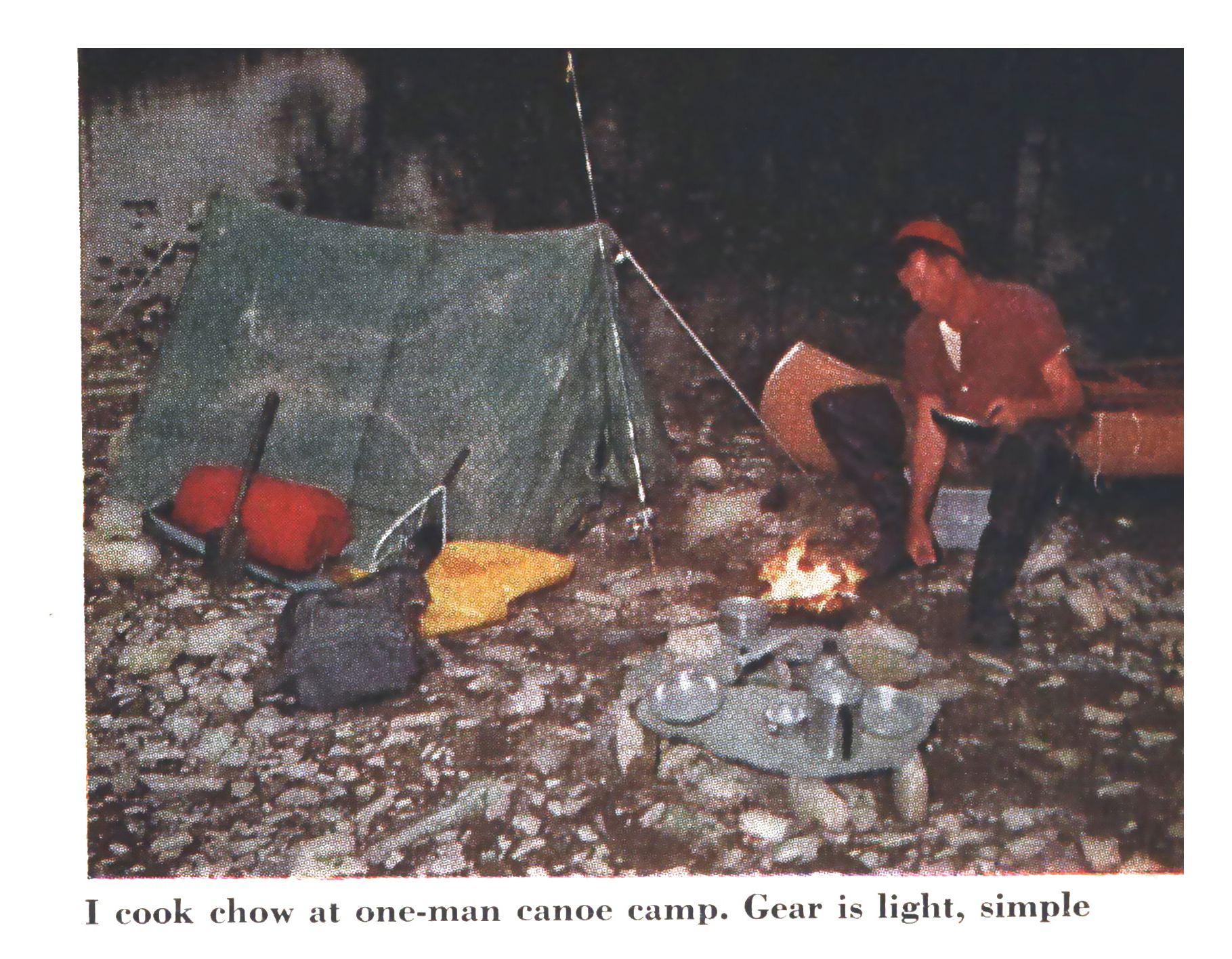 A vintage photo of a one-man canoe camping trip.