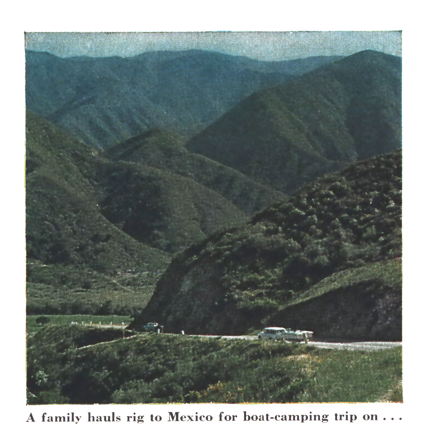 A vintage photo of an RV and boat headed to Mexico with green hills in the background.