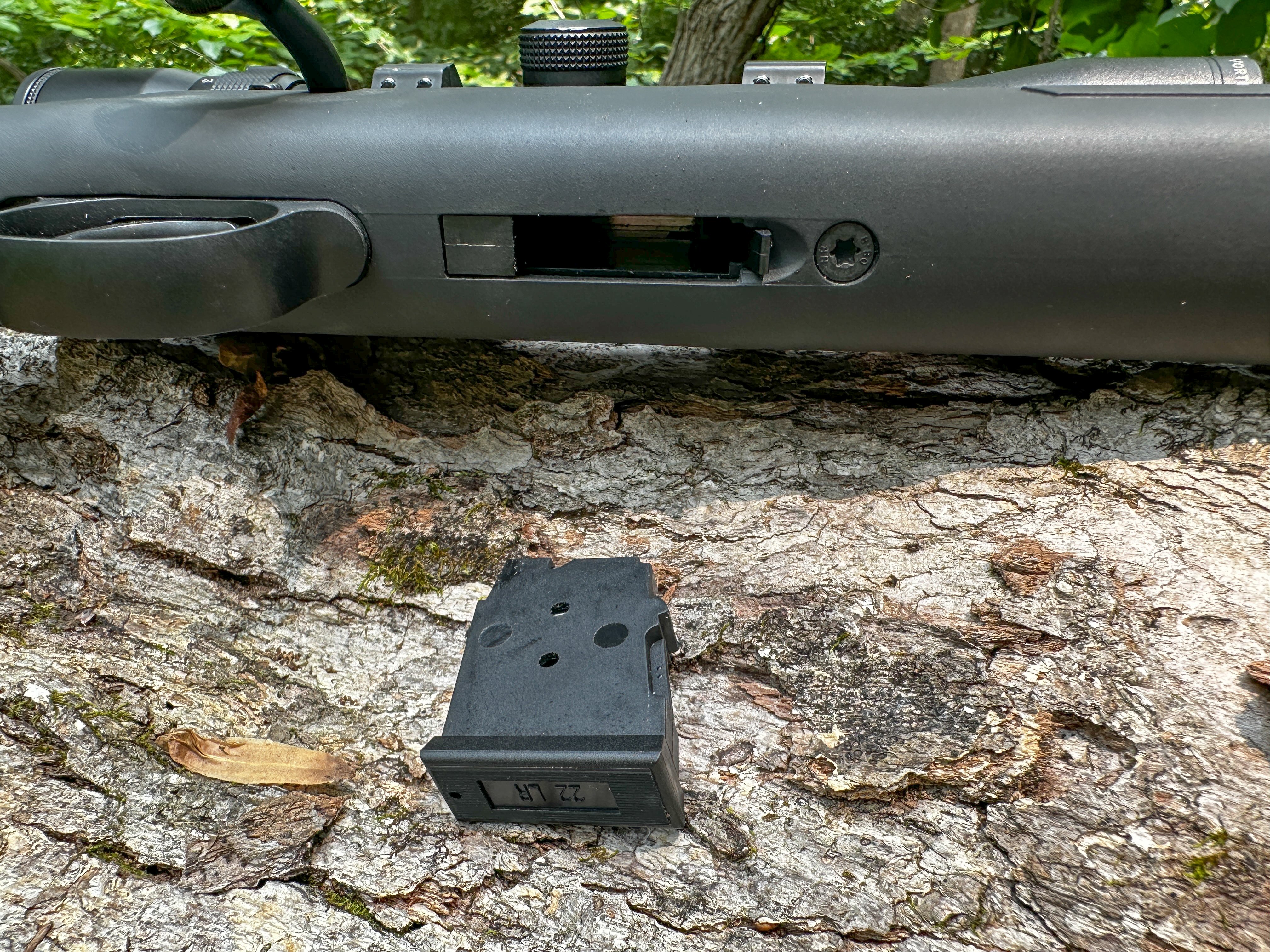 The 457 magazine well and 5-round magazine.