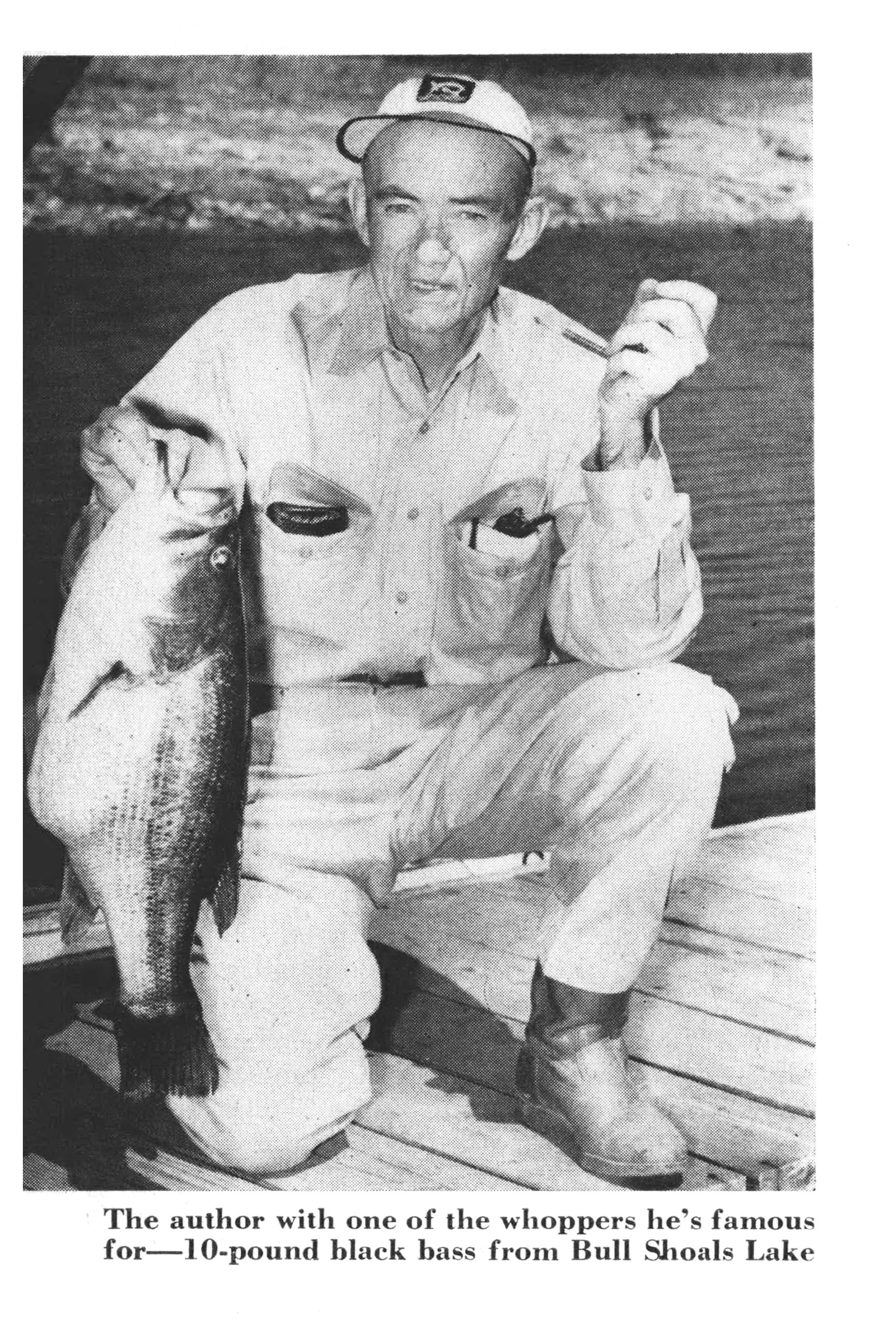 Angler Sam Welch kneels on a dock holding up a large black bass, one of the roughly 10-pound Bull Shoals lunkers he was known for