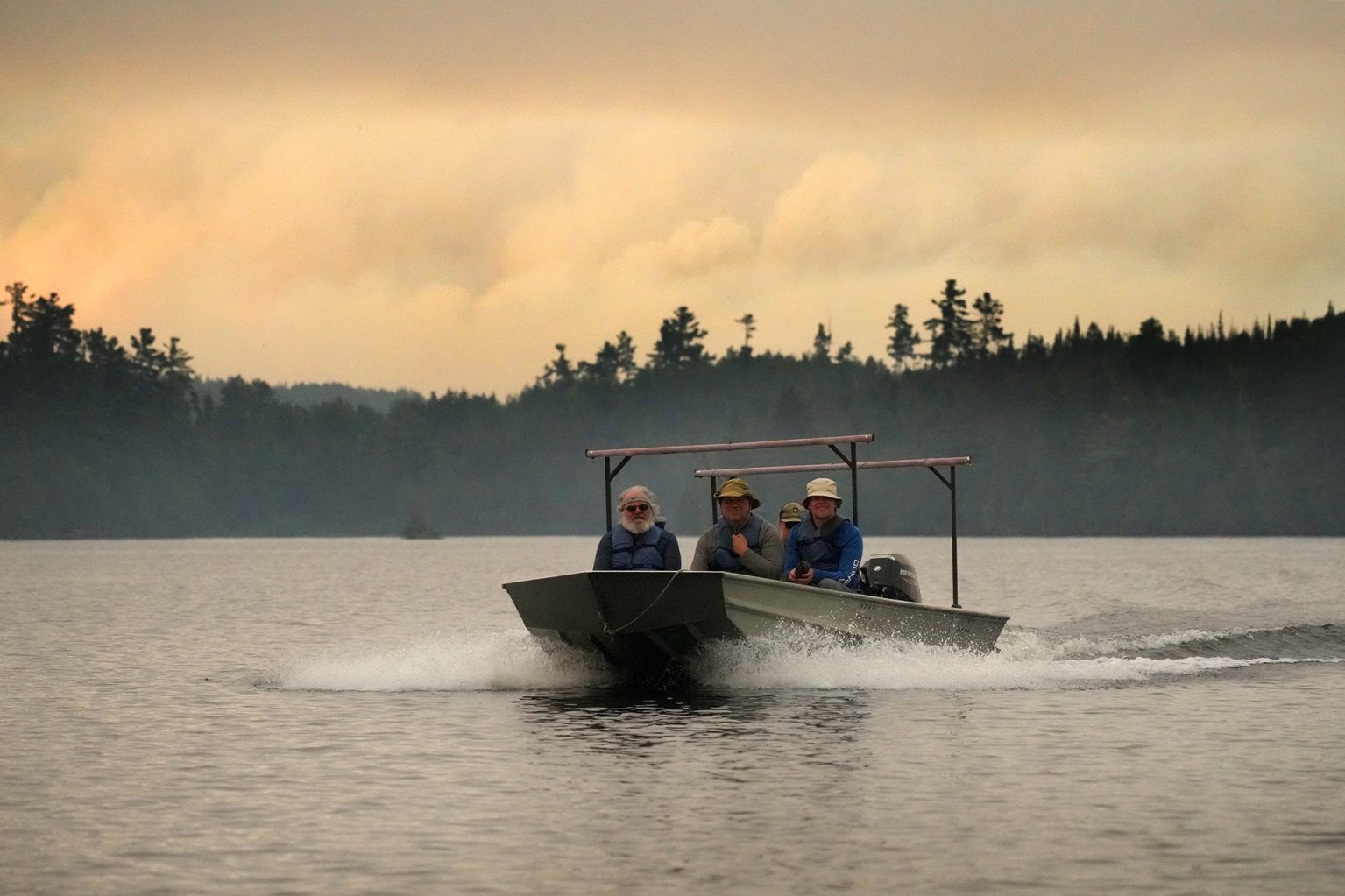 ELY, MN. - JULY 2026: U.S. Forest Service employees use a tow boats to evacuate canoeists from the Boundary Waters Canoe Area Wilderness after multiple wildfires burning there prompted its closure and evacuation Tuesday, July 14, 2026 in Ely, Minn.(Photo by Anthony Soufflé/The Minnesota Star Tribune via Getty Images)