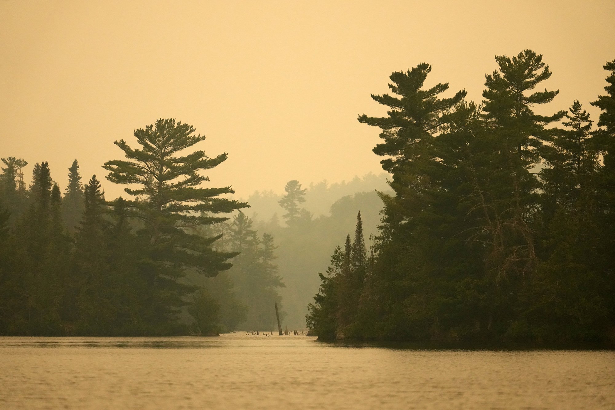 ELY, MN. - JULY 2026: Heavy smoke from the Camp Fire hangs in the air over Birch Lake in the Boundary Waters Canoe Area Wilderness on Wednesday, July 15, 2026 near Ely, Minn. Photo by Anthony Soufflé/The Minnesota Star Tribune via Getty Images