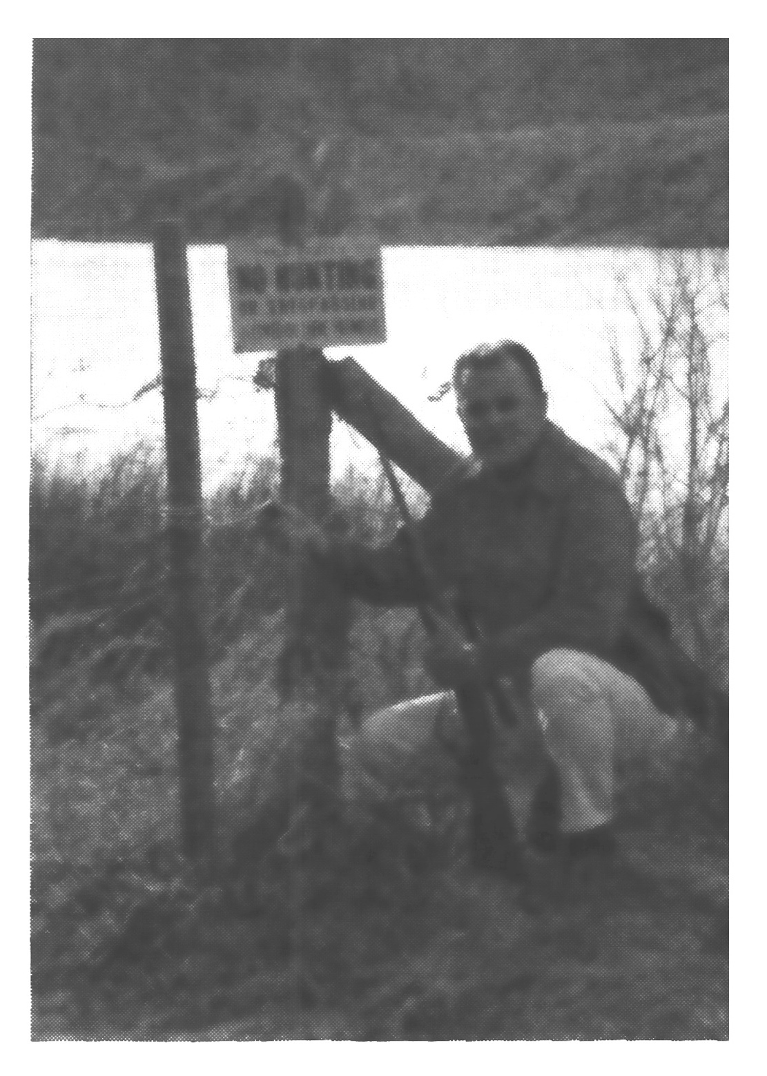 Ben East beside a no trespassing sign.