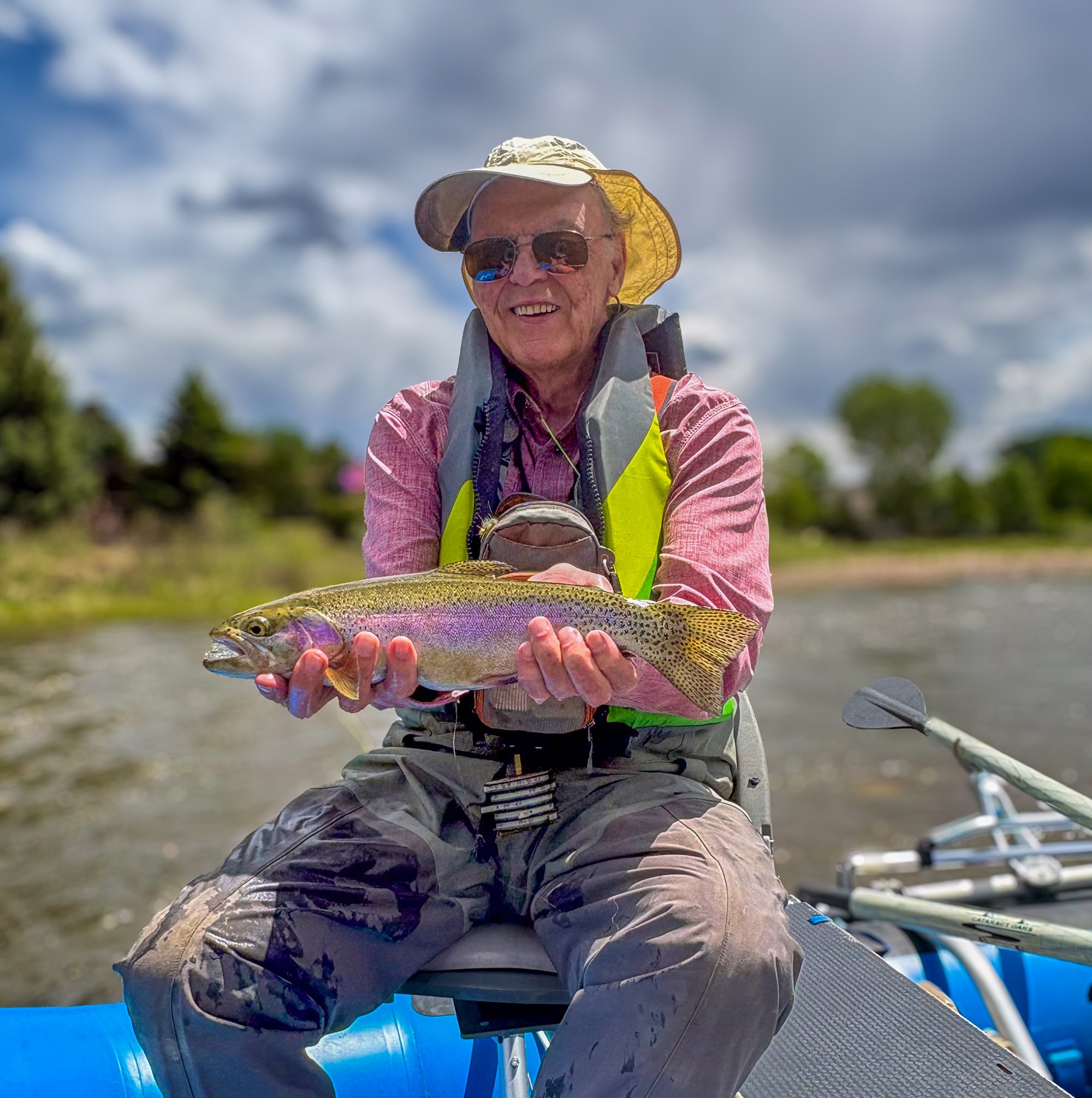 Roger hill holds up a trout