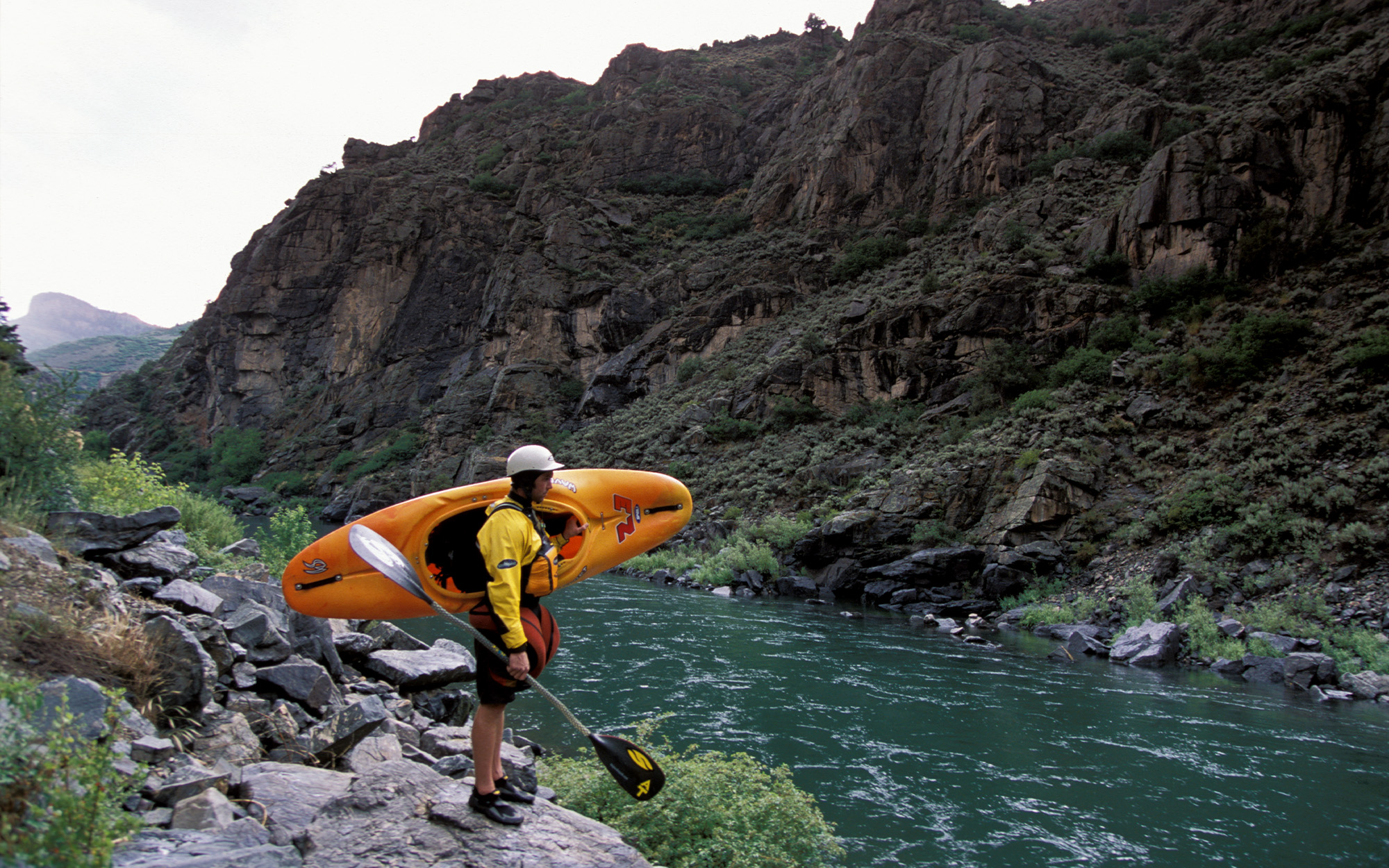 A kayaker in a canyon in Colorado.