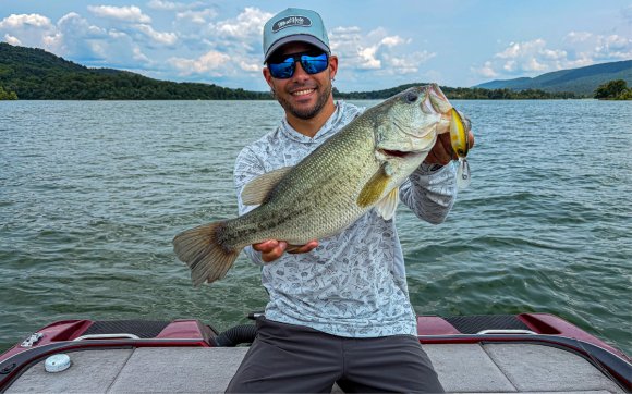 The author holds a big bass caught on a deep diving crankbait
