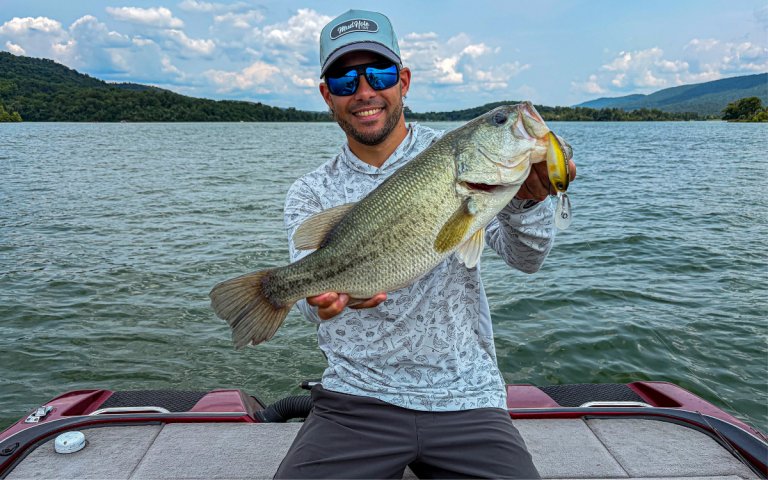 The author holds a big bass caught on a deep diving crankbait