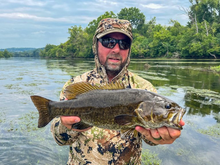 Jacob Ott holds up a nice smallie caught while wading.