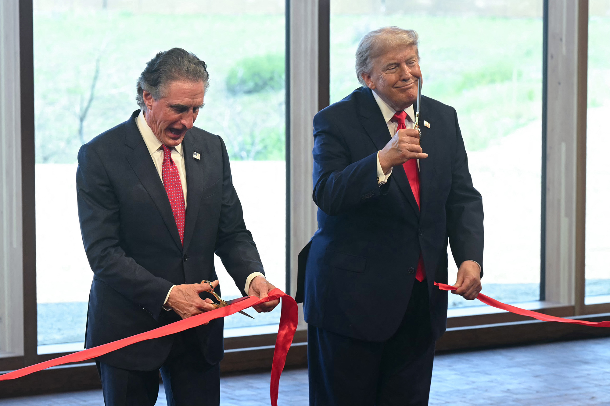 A ribbon cutting ceremony at the Theodore Roosevelt Presidential Library.