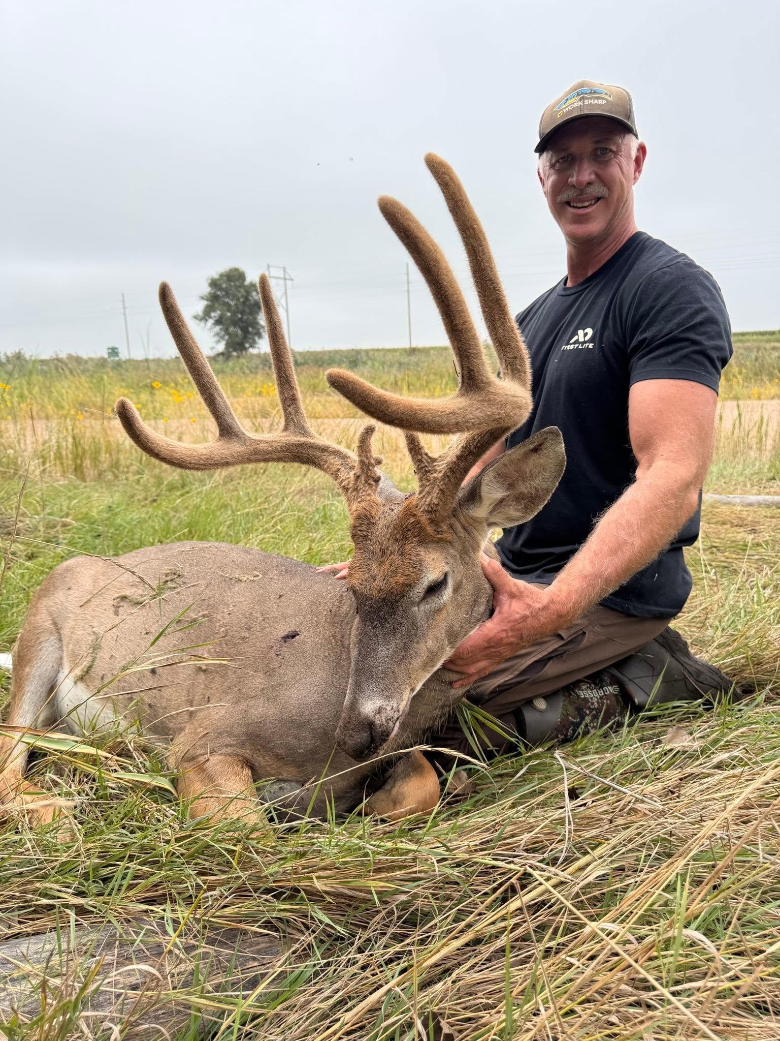 hunter with a velvet buck