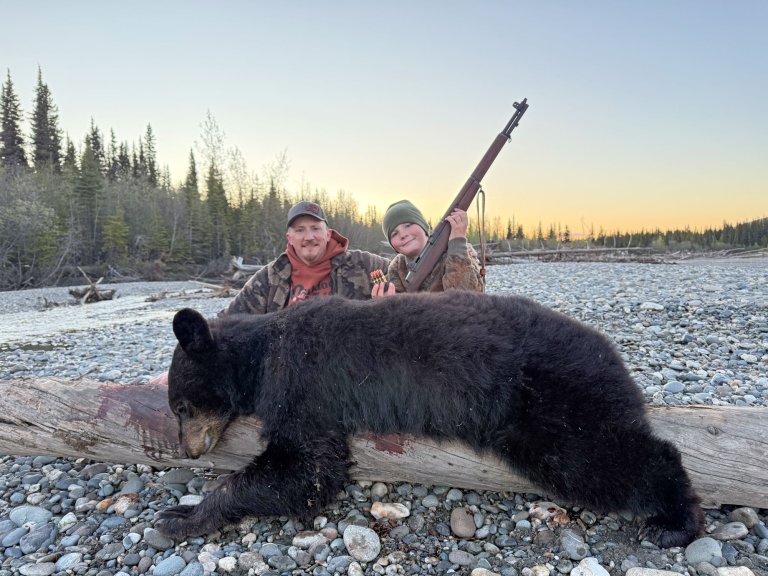 freel and son with black bear