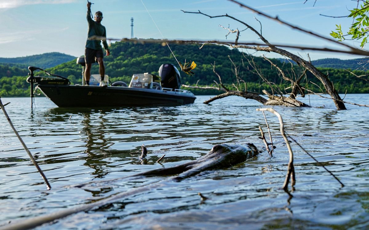 The author on a boat casting into a laydown
