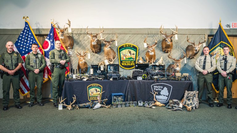 A photo of the recovered wildlife and officers from the Creek Kings poaching bust.