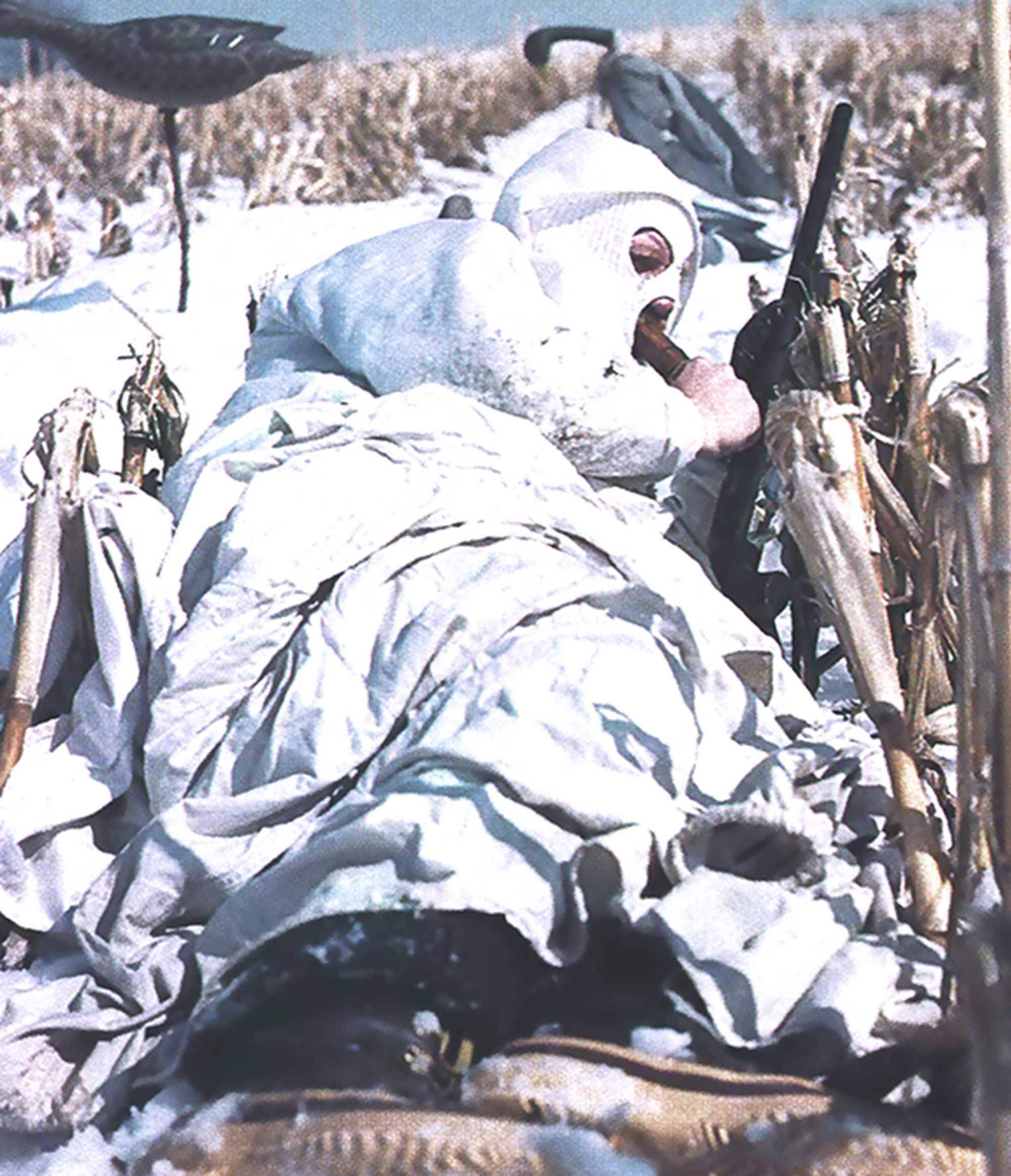waterfowl hunter in a corn field